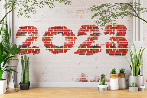 2023 New Year Concept with Green Plants and Brick Wall. 3D Render