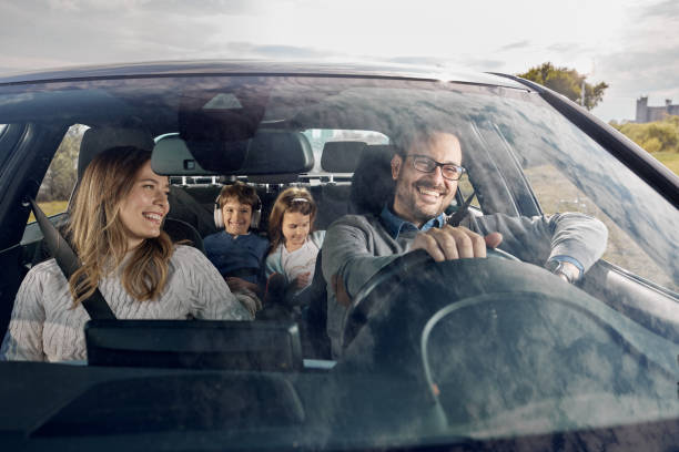 happy family enjoying while going on a vacation by car. - vacations two generation family caucasian friendship imagens e fotografias de stock