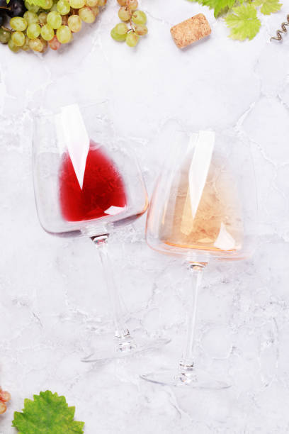 istock Rose and red wine glasses and grape 1425793990