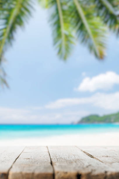 istock Empty wooden table or pier with sunny beach and sea 1425795168
