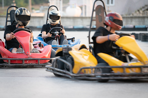 Group of teens riding go carts