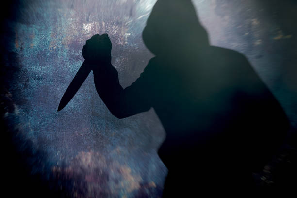 istock Silhouette criminal holding knife 1425800848