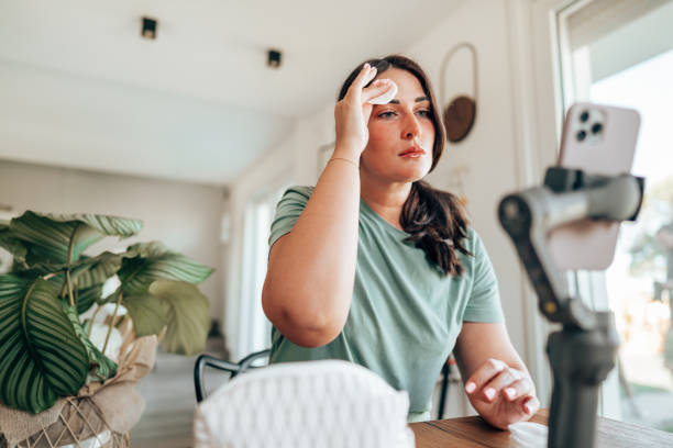istock woman using make up products at home 1425802180