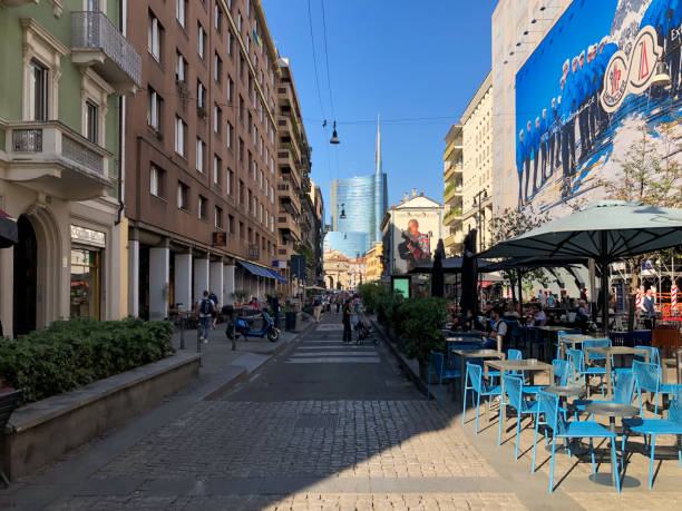 Via della Moscova (Moscova street) in the fashion district near Brera and Garibaldi district with the steel and glass skyscraper Unicredit Tower in Milan in the Porta Nuova district in background. Via della Moscova (Moscova street) in the fashion district near Brera and Garibaldi district with the steel and glass skyscraper Unicredit Tower in Milan in the Porta Nuova district in background. milan fashion week stock pictures, royalty-free photos & images