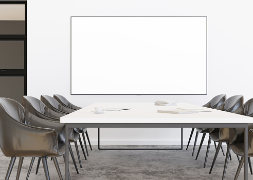 Conference room with blank, empty TV screen. Monitor mock up. Business meeting room with LCD screen for presentation, advertising. Modern, contemporary office. Copy space, template. 3d rendering