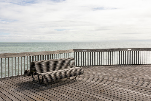 modern wooden bench overlooking the sea