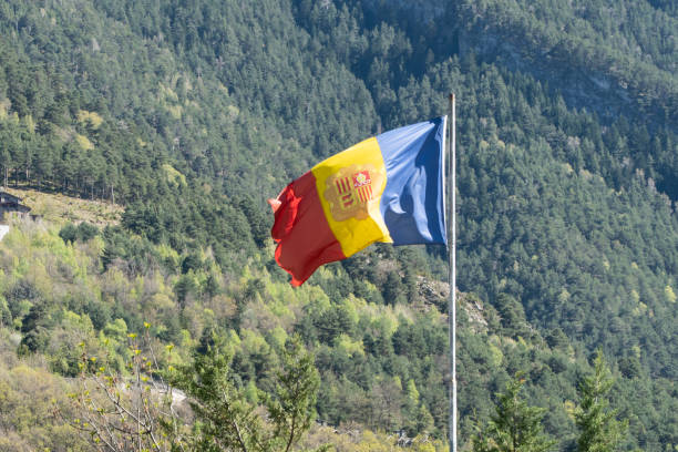 istock Flag of Andorra with mountains at background 1425809212