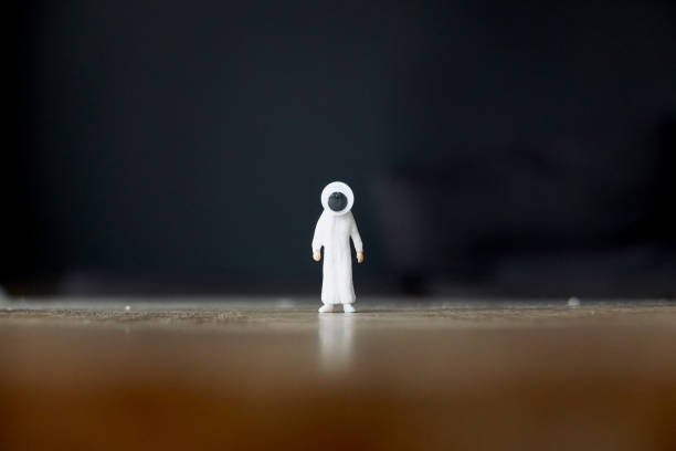 Desert man standing in a wide field with big eye