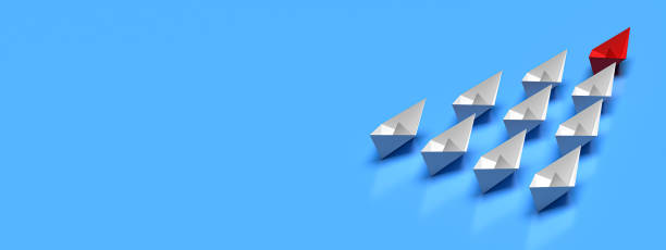 istock Leadership and business concept. One red leader ship leads other white ships forward with blank background 1425812831