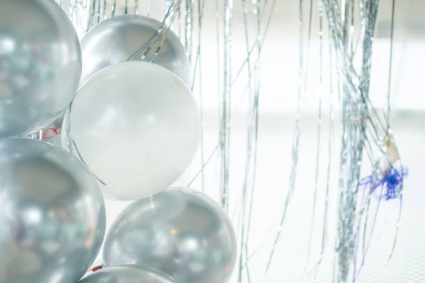 istock Silver and white colored balloons for party decoration, festive decorative elements 1425814415