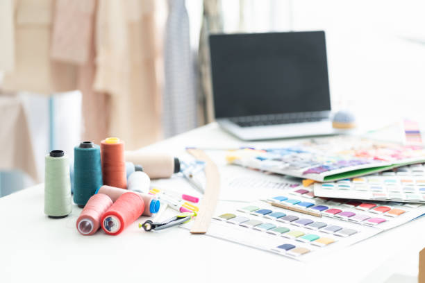 istock Multi colour of thread, colour samples choosing fabric textile on the table in tailor shop. Fashion, dressmaking concept 1425817436