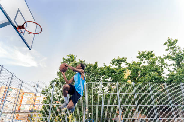istock Shirtless Sporty Man Playing Basket 1425817754
