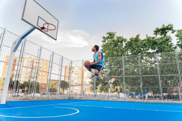 istock Shirtless Sporty Man Playing Basket 1425817771