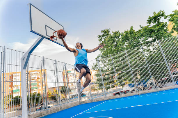 istock Shirtless Sporty Man Playing Basket 1425817781