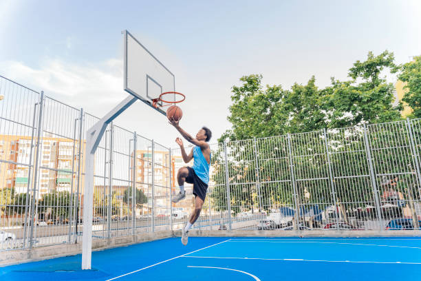 istock Shirtless Sporty Man Playing Basket 1425817847