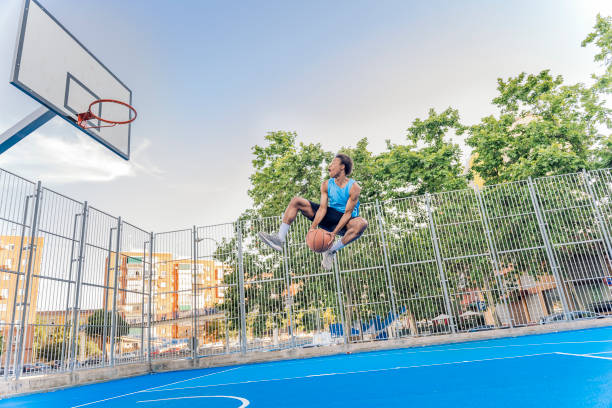 istock Shirtless Sporty Man Playing Basket 1425817859