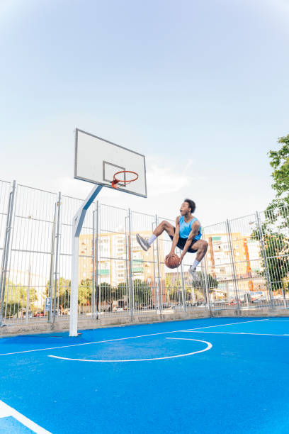 istock Shirtless Sporty Man Playing Basket 1425817914