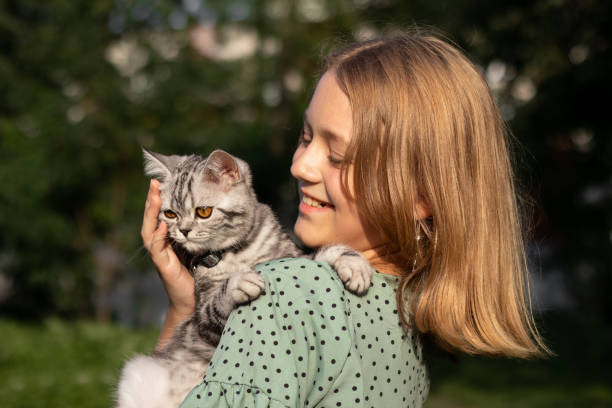 istock Cat being embraced by its owner. 1425818446