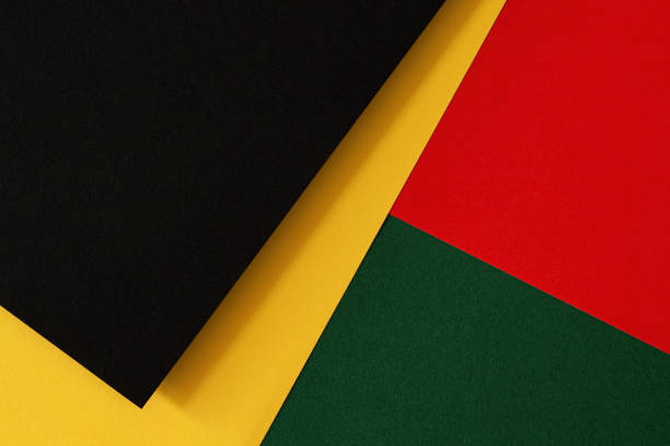Abstract geometric black, red, yellow, green color paper background. Black History Month color background with copy space for text Abstract geometric black, red, yellow, green color background. Black History Month color background with copy space for text. african american culture photos stock pictures, royalty-free photos & images