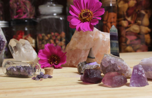 istock Amethyst Crystals With Flowers and Incense Cone on Meditation Table 1425820113