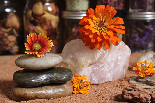 Balance Stones and Rose Quartz With Flowers on Australian Red Sand