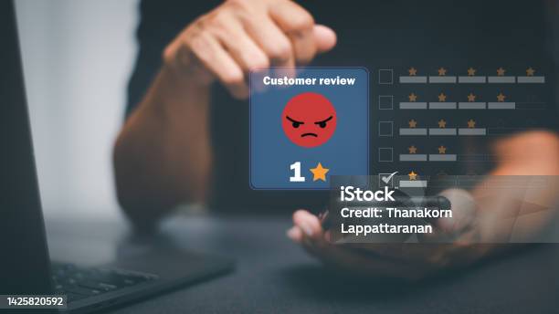Male Consumers Express Dissatisfaction After Receiving A Product Or Service Negative Rating Ideas From A Business Or Product Online Ratings Performance Data And Evaluation Of Genuine User Reviews Stock Photo - Download Image Now