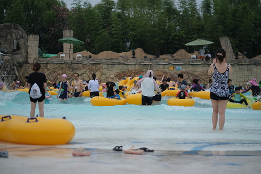 Shanghai,China-July 16th 2022: many Chinese people playing at water park in summer