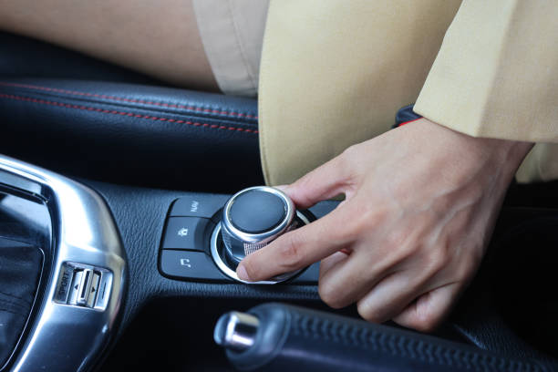 istock transportation and vehicle concept - woman using car audio stereo system 1425830533
