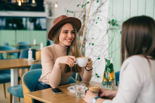 istock friends takking in cafeteria 1425836407
