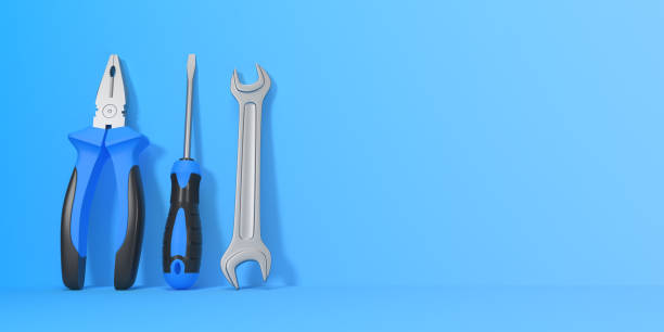 istock Wrench, screwdriver and pliers on a blue background with copy space 1425837831
