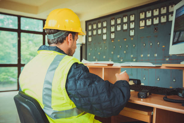 istock Electrician is working in electrical room in power station 1425839120