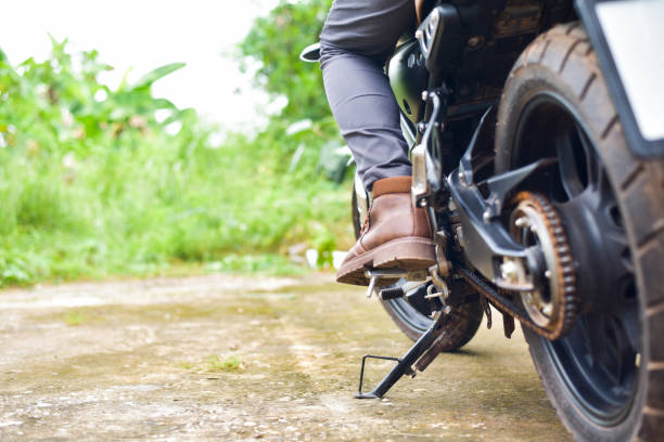 istock Biker with motobilk on nature background. 1425839623
