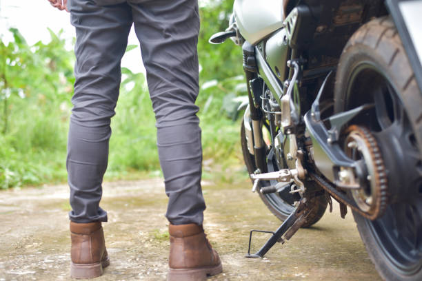 istock Biker with motobilk on nature background. 1425839625