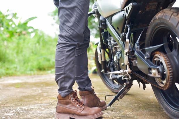 istock Biker with motobilk on nature background. 1425839626