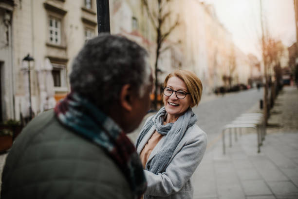 interracial senior couple lifestyle - human face heterosexual couple women men imagens e fotografias de stock