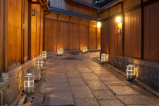 Lights reflect beautifully on the historic stone pavement in Higashiyama, Kyoto