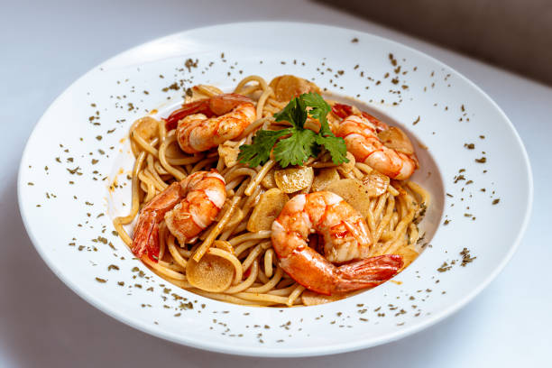 istock Shrimps Prawn Pasta Spaghetti served in a white plate 1425842978