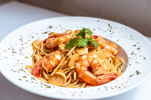 Shrimps Prawn Pasta Spaghetti served in a white plate
