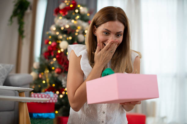 istock Happy woman celebrating Christmas 1425847175