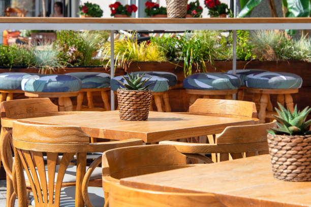 istock Empty table in outdoor cafe or restaurant. Tables and chairs at sidewalk cafe. Touristic setting, cafe table, sidewalk cafe furniture. 1425852933