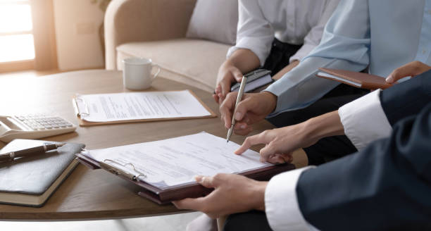 istock Real estate agent explaining and let customers sign a house purchase contract, discussing for contract to buy house, real estate concept and background. 1425853451