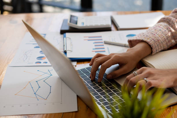 istock casual business work data analysis Charts and graphs computer use business finance and strategic accounting concepts 1425853869