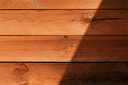 Worn wooden decking boards as background or graphic element