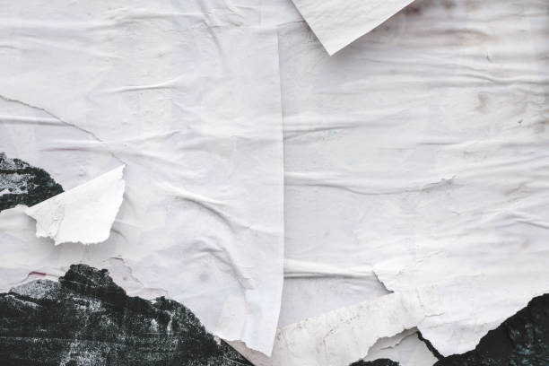 istock Shabby and messy crumpled and torn poster paper texture as graphic design element background 1425855200