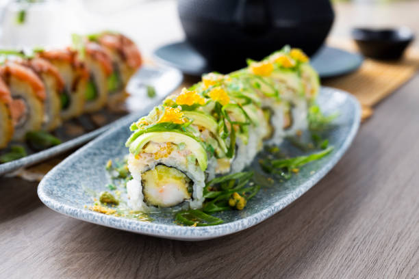 istock Sushi. Green sushi with avocado and prawn. 1425856597