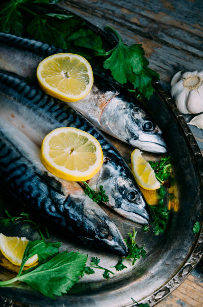 istock Fresh mackerel fish with lemon and spices 1425857407