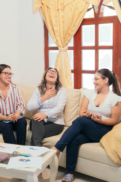 istock women discussing while enjoying themselves at the office 1425859121