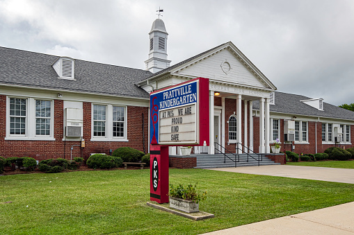 Prattville, Alabama, USA - Sept. 11, 2022: Front sign for Prattville Kindergarten School, housed in the previous Autauga County High School building built in 1936.