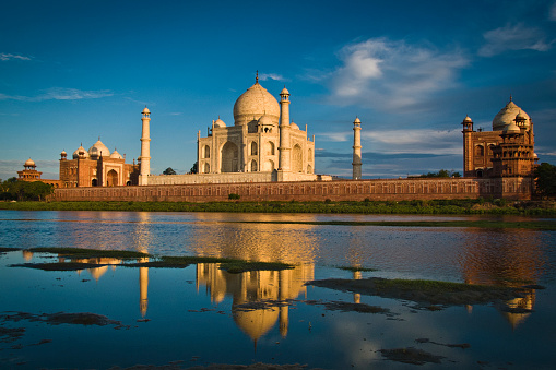 View of Taj Mahal palace reflected on Yamuna river in Agra, Uttar Pradesh, India