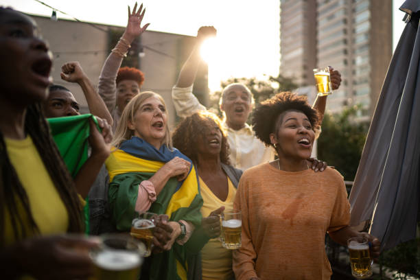 istock Brazilian team fans celebrating on a rooftop bar 1425864196